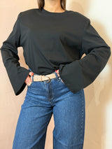 Maglia bianca con spalline imbottite e maniche a campana , nera - Lumina