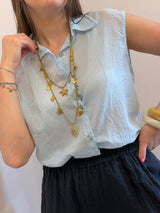 Camicia smanicata azzurra in mussola